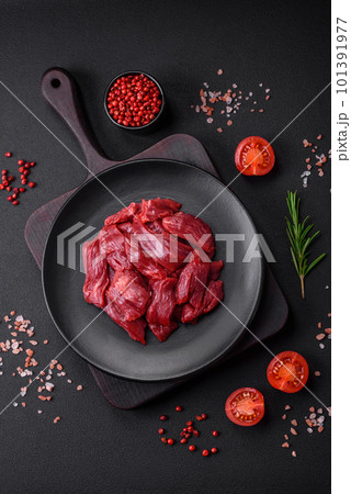 Fresh raw beef with salt, spices and herbs Fresh raw beef with salt, spices and herbs 101391977