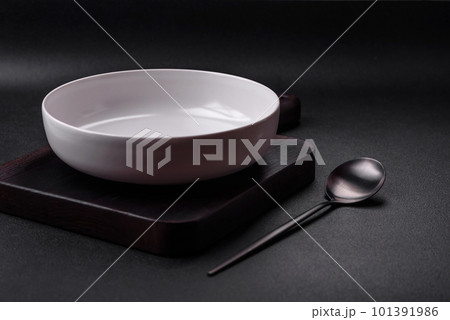 White empty soup bowl on a dark concrete background White empty soup bowl on a dark concrete background 101391986