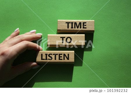 Time to listen symbol. Wooden blocks with words Time to listen. Beautiful green background. Businessman hand. Business and Active listening concept. Copy space. 101392232