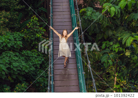 Young woman at the Suspension bridge in Kuala Lumpur, Malaysia Young woman at the Suspension bridge in Kuala Lumpur, Malaysia 101392422
