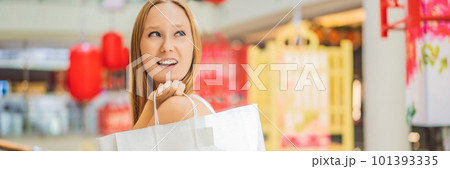 Woman hold shopping bag against the background of Chinese red lanterns for the Chinese New Year. Big sale in honor of the New Year's Eve. Black Chinese Friday 11.11 BANNER, LONG FORMAT Woman hold shopping bag against the background of Chinese red lanterns for the Chinese New Year. Big sale in honor of the New Year's Eve. Black Chinese Friday 11.11 BANNER, LONG FORMAT 101393335