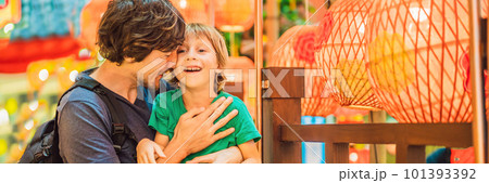 Dad and son celebrate Chinese New Year look at Chinese red lanterns BANNER, LONG FORMAT 101393392