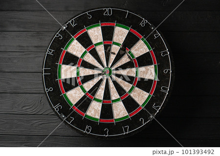 Three darts hit the dartboard. Lucky - one of the darts hits the bull's eye. The concept of winning Three darts hit the dartboard. Lucky - one of the darts hits the bull's eye. The concept of winning 101393492