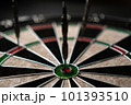 Three darts hit the dartboard. Lucky - one of the darts hits the bull's eye. The concept of winning 101393510