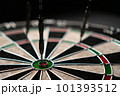 Three darts hit the dartboard. Lucky - one of the darts hits the bull's eye. The concept of winning 101393512
