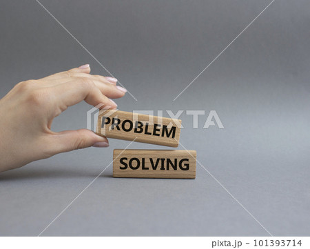 Problem solving symbol. Concept word Problem solving on wooden blocks. Beautiful grey background. Businessman hand. Business and concept. Copy space Problem solving symbol. Concept word Problem solving on wooden blocks. Beautiful grey background. Businessman hand. Business and concept. Copy space 101393714