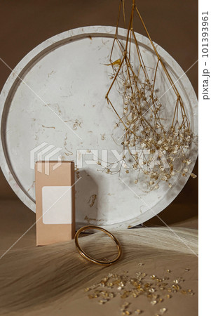 A strand of natural light hair for extensions with a box of care product. A strand of natural light hair for extensions with a box of care product. 101393961