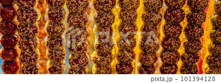 Traditional Chinese Dessert - Candied Fruit on a Wooden Stick BANNER, LONG FORMAT 101394128