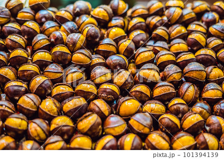 Bunch of roasted chestnuts at street wendor. Roasted Chestnuts, Street Food Bunch of roasted chestnuts at street wendor. Roasted Chestnuts, Street Food 101394139