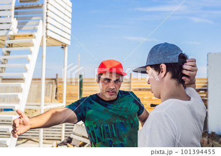 camera operator and director discuss the process of a commercial video shoot 101394455