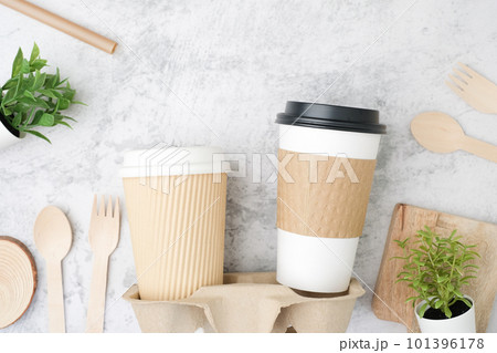 The biodegradable coffee cup with and cup holder. Recycled and sustainable to-go or take-away package for food and drink packaging. The biodegradable coffee cup with and cup holder. Recycled and sustainable to-go or take-away package for food and drink packaging. 101396178