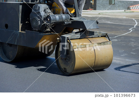 This is process of asphalting roads by using asphalt special equipment heavy vibration roller pavement operation. 101396673