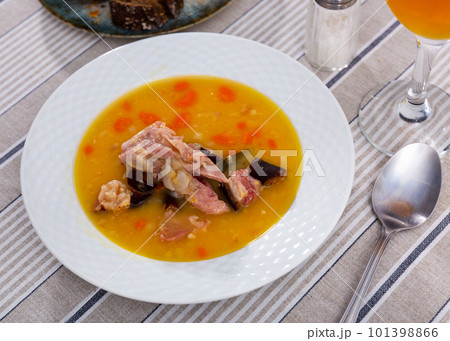 Hot pea soup with smoked meats and vegetables Hot pea soup with smoked meats and vegetables 101398866