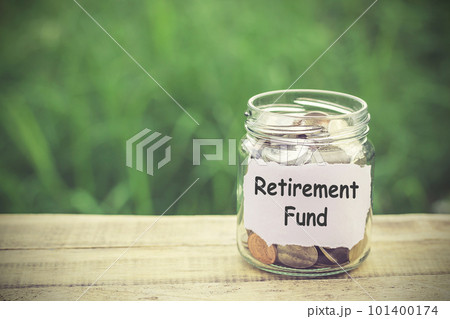 Money in the jar on wooden table Money in the jar on wooden table 101400174