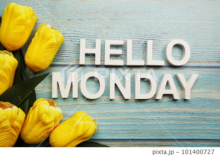 Hello Monday alphabet with yellow tulip flower on wooden background 101400727