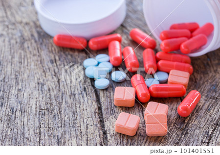 Close up pills on a wooden table. 101401551