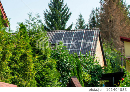 Historic farm house with modern solar panels on roof and wall High quality photo Historic farm house with modern solar panels on roof and wall High quality photo 101404088
