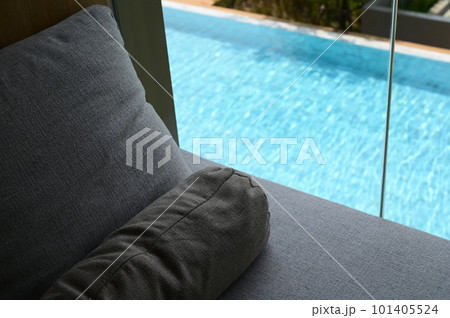 gray pillow put on bed, pool view gray pillow put on bed, pool view 101405524