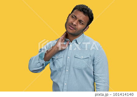 Portrait of indian man suffering from neck pain. Health problem and people concept. Portrait of indian man suffering from neck pain. Health problem and people concept. 101414140