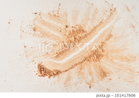 A smear of face powder, on a white background. Minimalistic modern cosmetic scene of bronzer or shadows, top view with space to copy. High quality photo 101417606