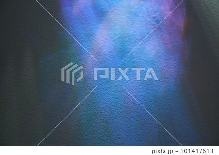 Holographic colors of lights and mother-of-pearl foil. Holographic abstract background in blue tones. Rainbow foil light on the wall with copy space. High quality photo Holographic colors of lights and mother-of-pearl foil. Holographic abstract background in blue tones. Rainbow foil light on the wall with copy space. High quality photo 101417613