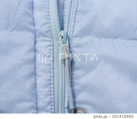 Fragment of a blue jacket with a zipper Fragment of a blue jacket with a zipper 101418900