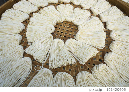 Close-up of traditional handmade noodle-making drying outdoors in Guanmiao, Tainan, Taiwan. 101420406