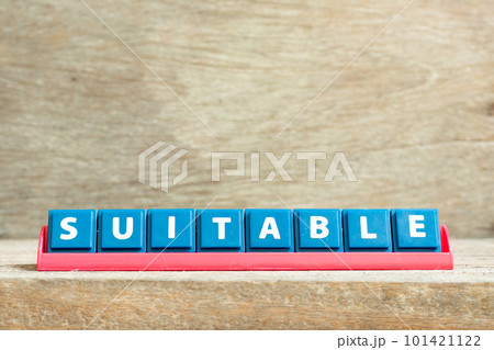 Tile letter on red rack in word suitable on wood background Tile letter on red rack in word suitable on wood background 101421122