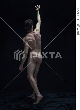 Relief body shape. Full-length portrait of handsome shirtless man posing in underwear against black studio background 101422128