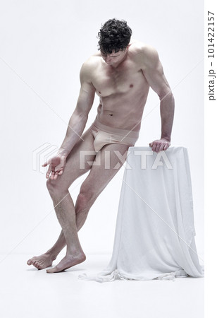 Full-length portrait of handsome man with muscular relief body posing shirtless in underwear against white studio background 101422157
