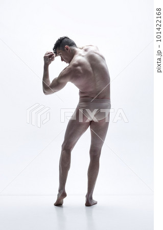 Full-length rear view image of shirtless man with muscular body shape, relief back posing underwear against white studio background 101422168