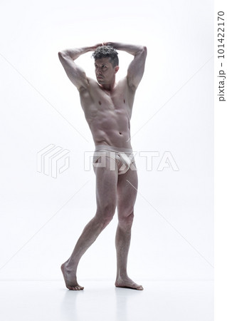 Full-length portrait of handsome man with muscular, relief, attractive body posing shirtless against white studio background 101422170