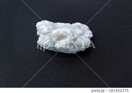 Albite crystal mineral, black background close up. Lepidolite 101422275