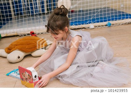 children girl play inside holiday beautiful dress 101423955