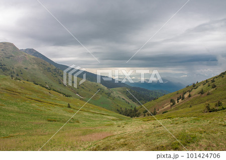 Valley under Maly Krivan, view from mountain pass Bublen, national park Mala Fatra, Slovakia, spring cloudy day. 101424706