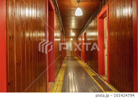 Corridor with wooden paneling inside a mountain cottage. Corridor with wooden paneling inside a mountain cottage. 101424794
