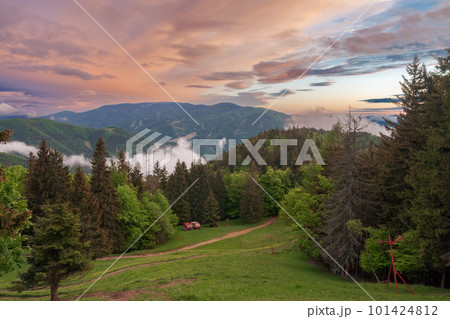 Two snowcats, view from chalet under Suchy, national park Mala Fatra, Slovakia, spring sunset time. 101424812