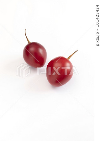 Isolated Fresh Tamarillo Fruit On White Background. Egg-shaped Edible Fruit Known As Tree Tomato, Plant Family Solanaceae, Solanum Betaceum. Top View. Flat Lay. Vertical Plane Isolated Fresh Tamarillo Fruit On White Background. Egg-shaped Edible Fruit Known As Tree Tomato, Plant Family Solanaceae, Solanum Betaceum. Top View. Flat Lay. Vertical Plane 101425424
