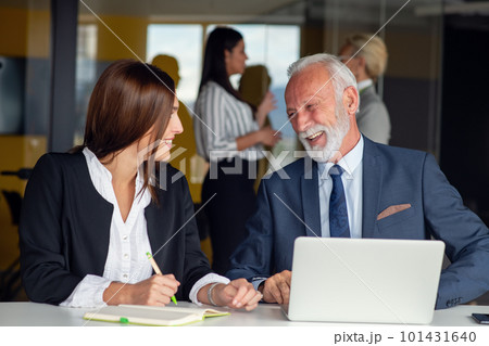 Mature businessman leader mentor talking to diverse colleagues team listening to caucasian ceo. Mature businessman leader mentor talking to diverse colleagues team listening to caucasian ceo. 101431640