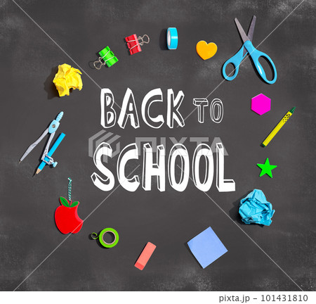 Back to school theme with school supplies on a chalkboard Back to school theme with school supplies on a chalkboard 101431810