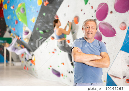 Adult man posing on climbing wall 101432654
