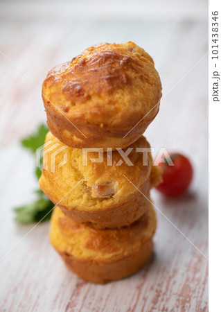 Savory muffin with ham and cheese on blue background 101438346