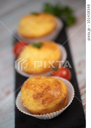 Savory muffin with ham and cheese on blue background 101438348