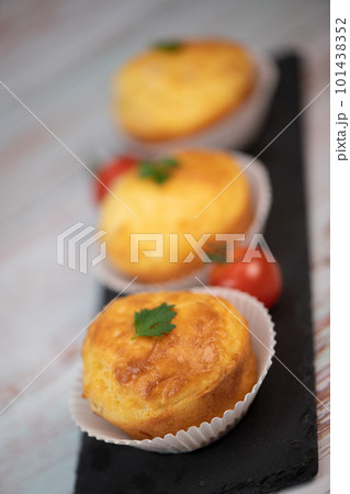 Savory muffin with ham and cheese on blue background 101438352