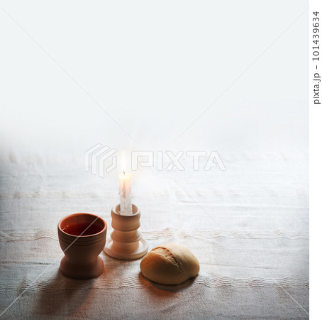A bowl of wine and bread on the table. Communion symbols A bowl of wine and bread on the table. Communion symbols 101439634