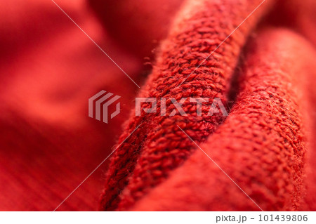 closeup red knitted woolen fabric texture background 101439806