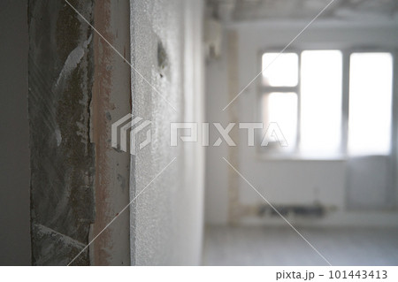 Interior of a new apartment without finishing in gray tones. Interior of a new apartment without finishing in gray tones. 101443413