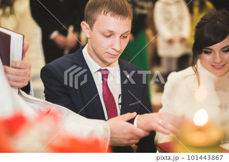 Wedding couple bide and groom get married in a church Wedding couple bide and groom get married in a church 101443867