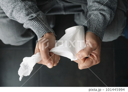 man grabbing a piece of paper sitting in the toilet man grabbing a piece of paper sitting in the toilet 101445994