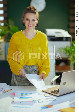 business owner woman in green office working with documents 101449959
